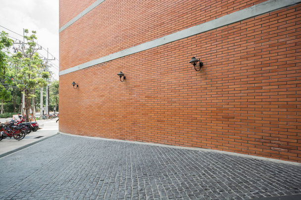 outdoor architecture with vibrant red brick wall,walkway in school. - Photo, Image