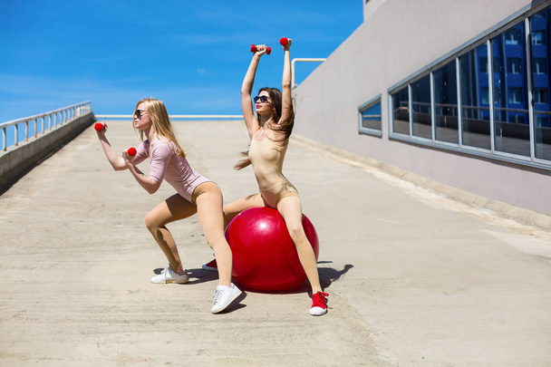 Pretty women working out outside - Photo, Image