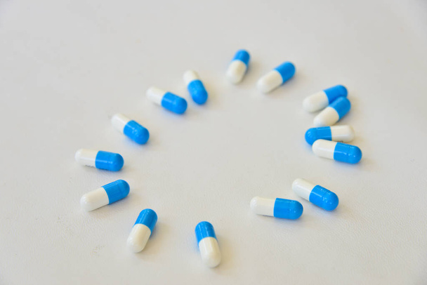 Blue pill on white background. - Photo, Image