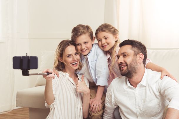 happy family taking selfie on smartphone - Zdjęcie, obraz