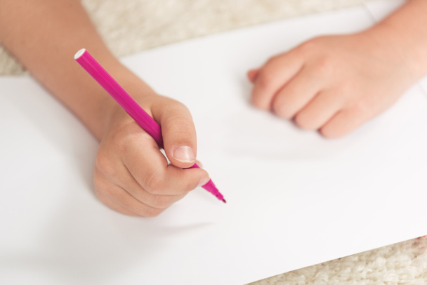 kid drawing with felt pen on paper - Photo, Image