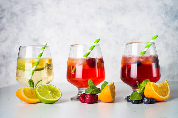 White, pink and red sangria with fruit - 写真・画像