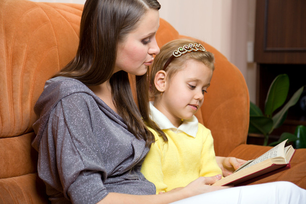 Mother and daughter reading book - Photo, Image