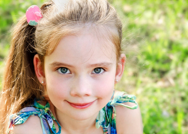 Portrait of adorable smiling little girl outdoor  - Foto, Imagem