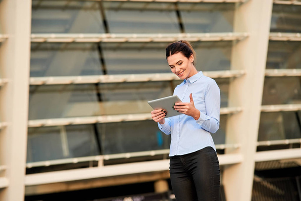 Businesswoman with tablet smiling. - Photo, Image