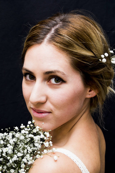 Portrait of a beautiful Woman with white flowers as a bride on h - Zdjęcie, obraz