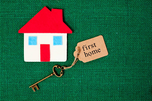 House with First Home key on green background - Photo, Image