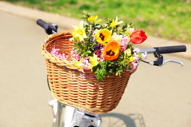 Bicycle with beautiful basket of flowers  - Fotoğraf, Görsel