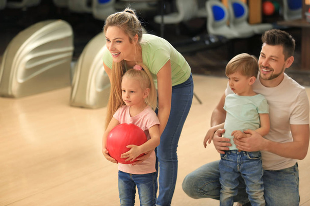 Family having fun at bowling club - Photo, Image