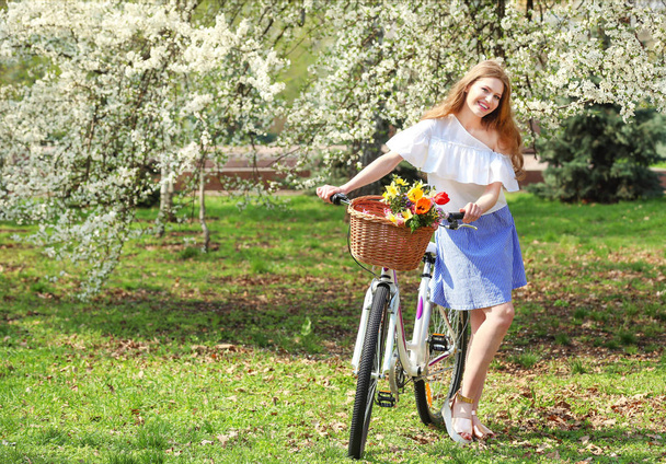 young woman near bicycle - Photo, image