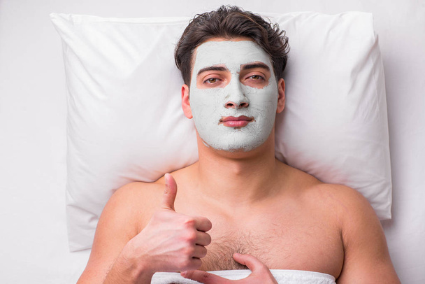 Handsome man in spa massage concept - Valokuva, kuva