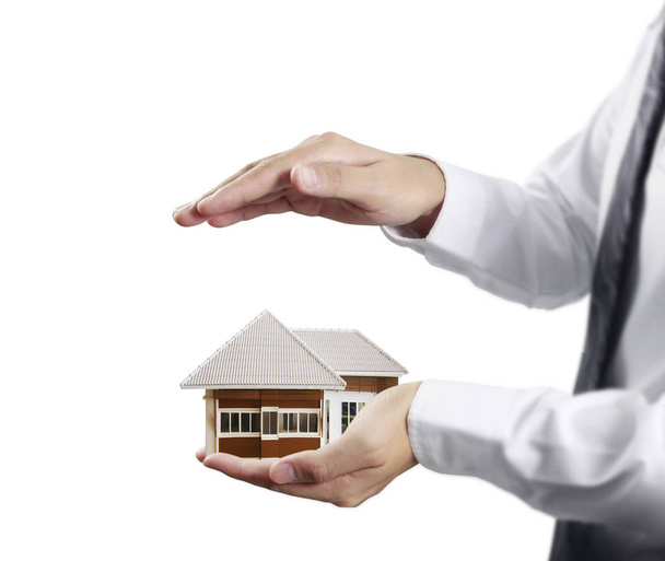 Business man house in human hands  - Photo, Image