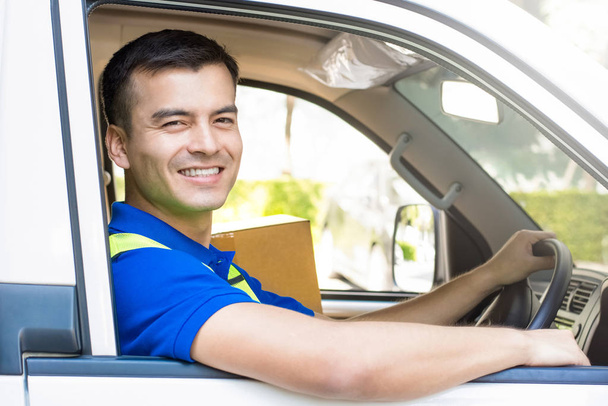 Delivery man driving a car - 写真・画像