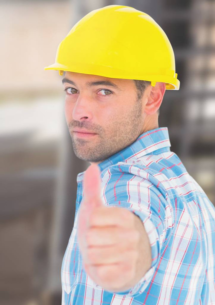 Construction Worker with thumbs up in front of construction site - Fotoğraf, Görsel