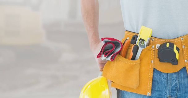 Construction worker Carpenter on building site - Фото, изображение