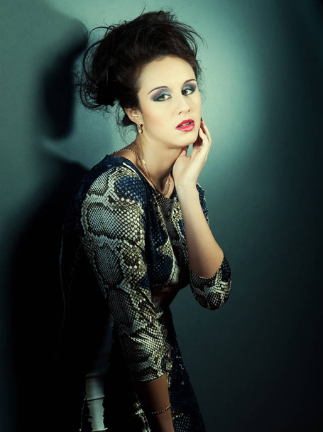 fashion model woman over blue background - Fotó, kép