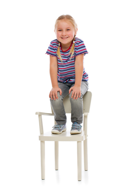 smiling girl sitting on a chair - Фото, зображення