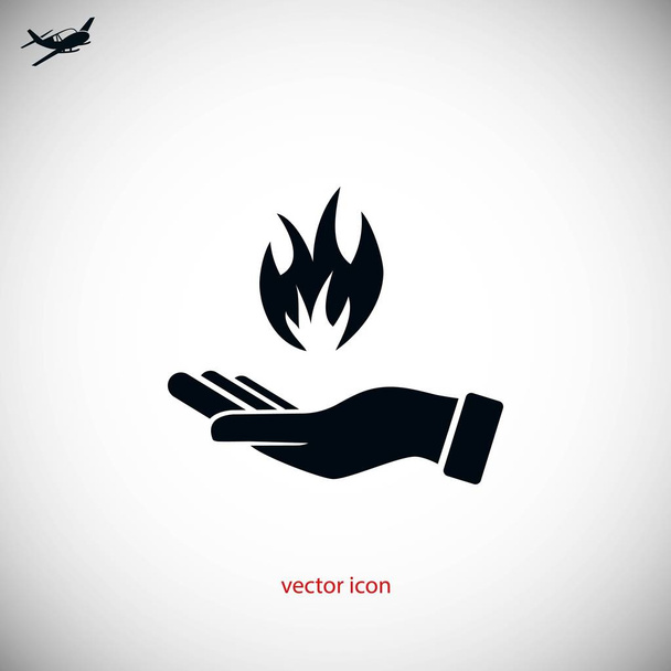 kezében egy tűz-ikon - Vektor, kép