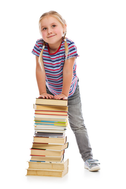 little girl with a pile of books - Фото, изображение