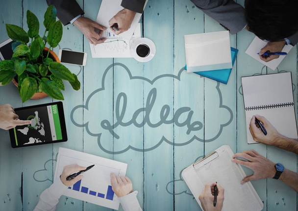 Overhead of business team on blue wood panel with idea doodle - Foto, Imagem