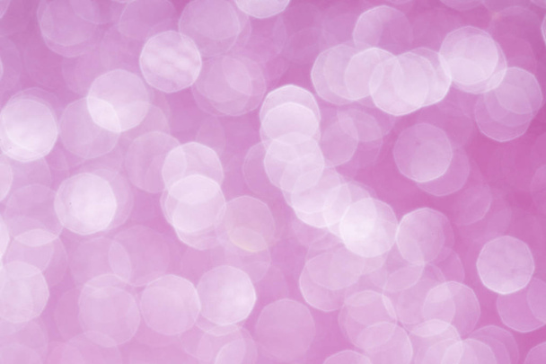 Pink glittering lights. Blurred abstract background. - Foto, afbeelding