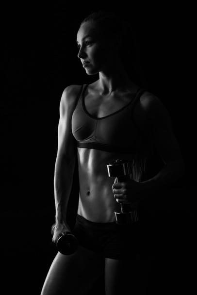 sportswoman training with dumbbells - Photo, Image