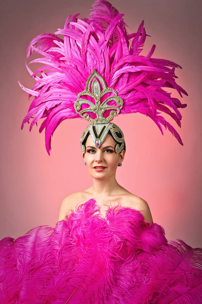  Beautiful Girl in carnival costume with pink feathers. - Photo, Image