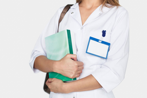 Female doctor with book in hands - Zdjęcie, obraz