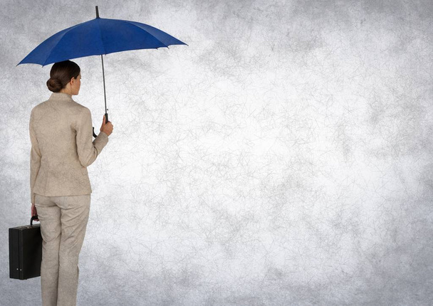Back of business woman with umbrella and briefcase against white background - Foto, Bild