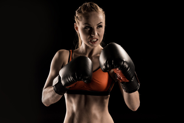 Sportvrouw in bokshandschoenen  - Foto, afbeelding