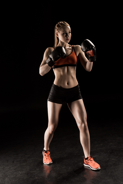 Sportswoman in boxing gloves  - Fotó, kép