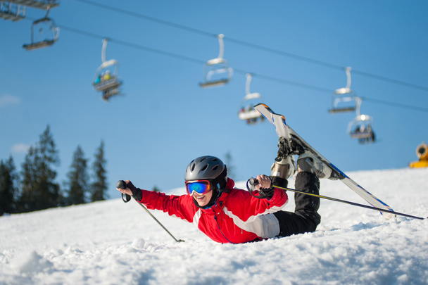 Woman skier with ski at winer resort in sunny day - Photo, Image