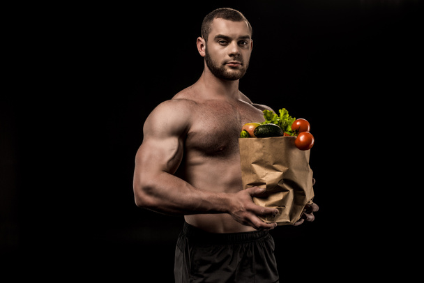 shirtless man with healthy food - Foto, afbeelding