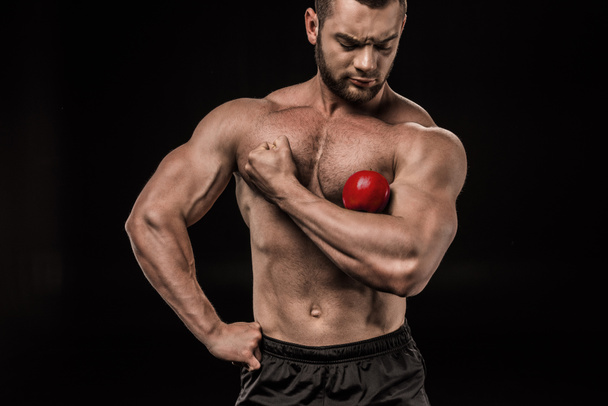 shirtless man with apple - Foto, afbeelding