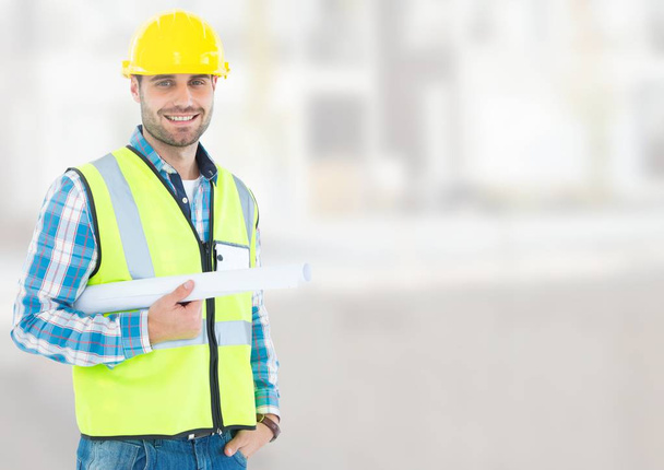 Architect with blueprints on building site - Photo, Image