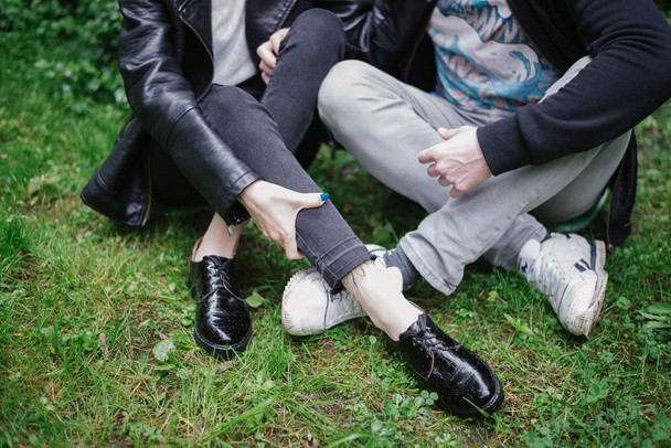 legs of couple that sitting at the park - Photo, Image