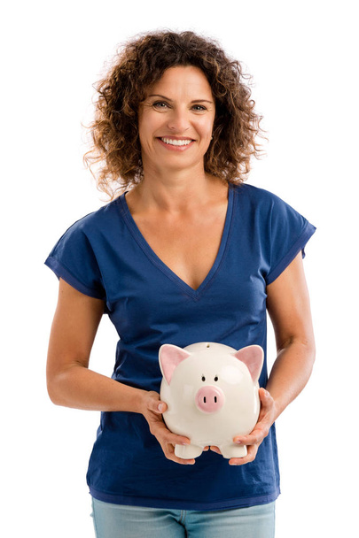woman holding a piggybank - Фото, изображение