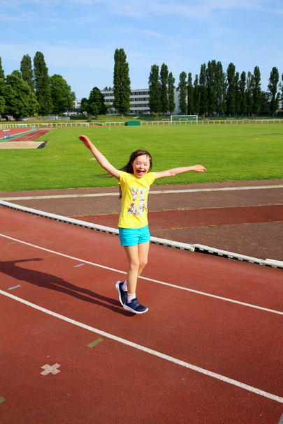 Little girl have fun on the stadium - Photo, Image
