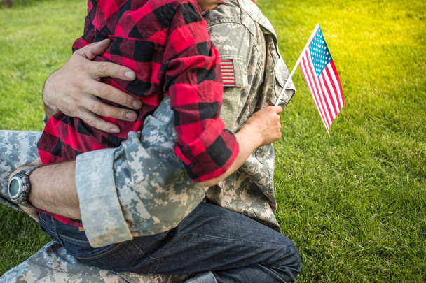 Happy reunion of soldier with family outdoors - Photo, image