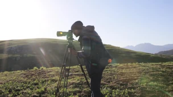 The photographer shot the mountain landscape on the background. - Video