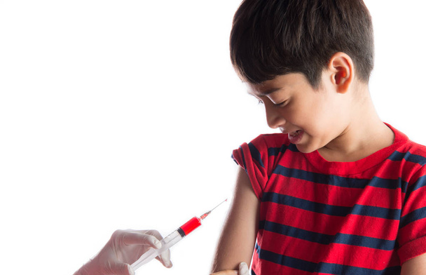 Doctor giving injection of vaccine to kid - Zdjęcie, obraz