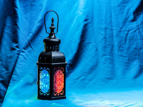 lighting on muslim style's lantern shining on cloth table - Photo, Image