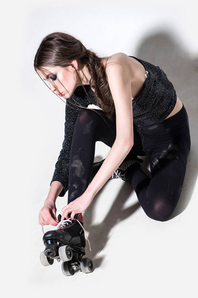 young girl or beautiful woman in skate roller on legs - Φωτογραφία, εικόνα