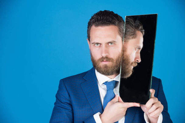 businessman, bearded serious man reflecting in mirror - Фото, изображение
