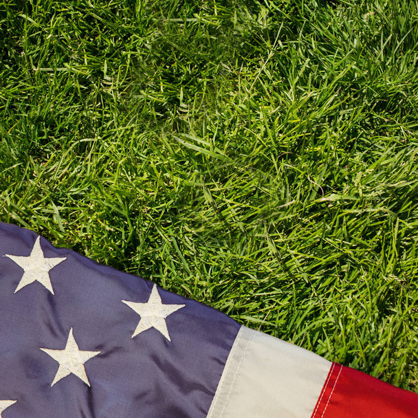 creased us flag against grass - Photo, Image