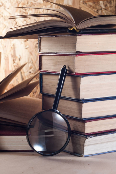 Magnifying glass and books, - Photo, Image