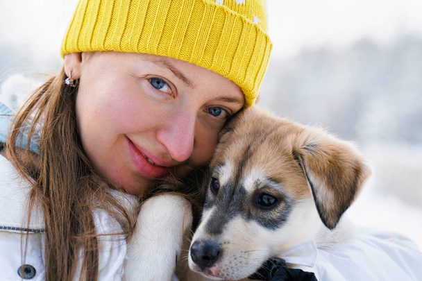 Girl and Husky puppy in Lapland Finland - Photo, Image