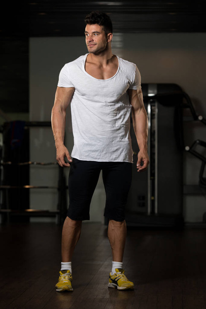 Portrait of Muscle Man in White T-shirt - Фото, изображение