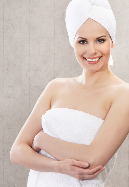 Young attractive woman in towel - 写真・画像