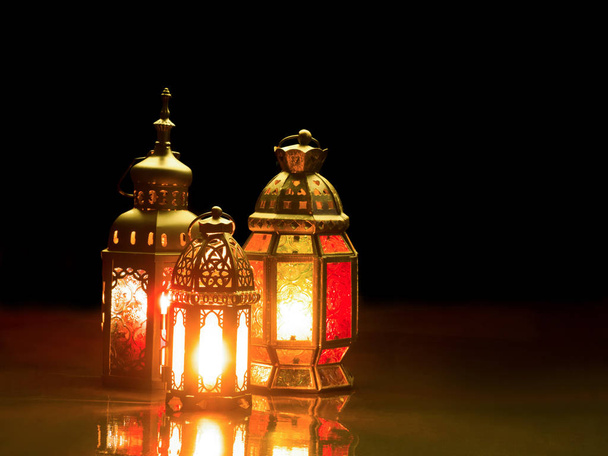 Candle light lids on muslim style's lantern shining on the dark - Photo, image